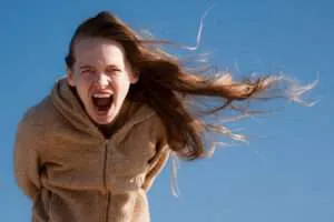 Woman with long hair screaming