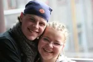 Couple hugging and facing camera