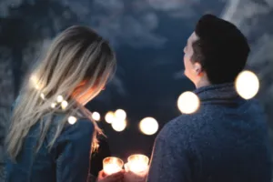 Man and woman, couple, holding candles