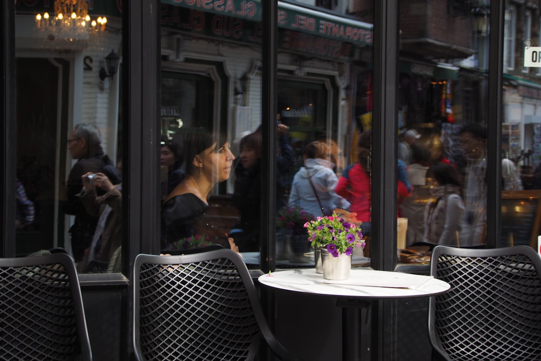 A table with a cake on it in front of a window