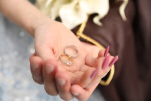 a close up of a person holding a ring