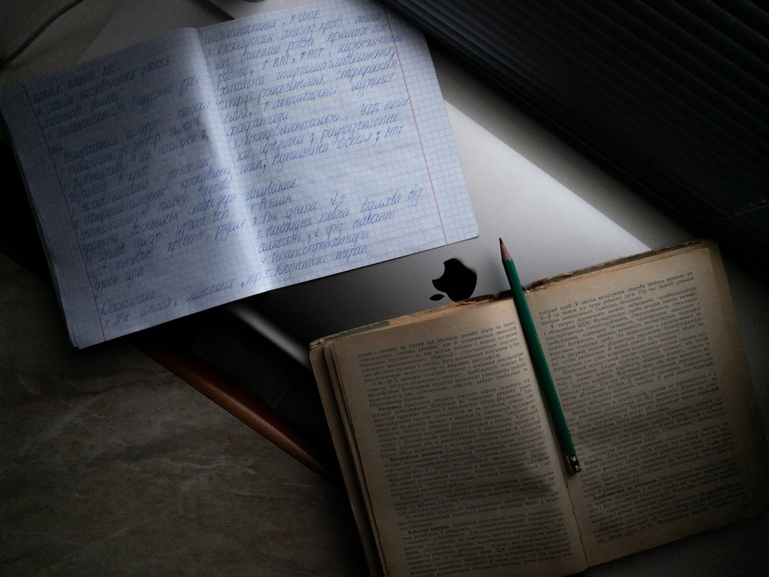 white printer paper on brown wooden table